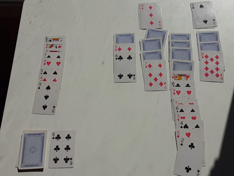 A mid-game Klondike Solitaire layout with several possible plays.